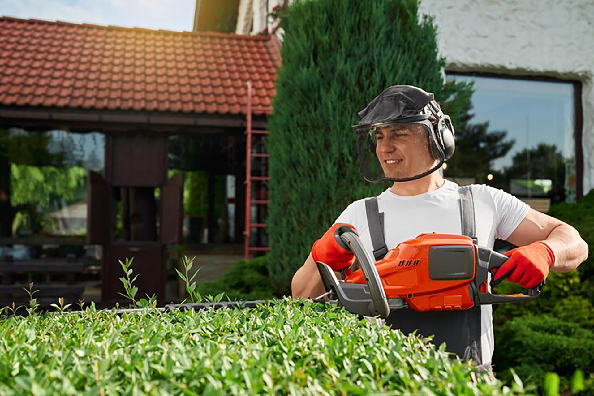 young-man-safety-mask-gloves-shaping-bushes_651396-3823